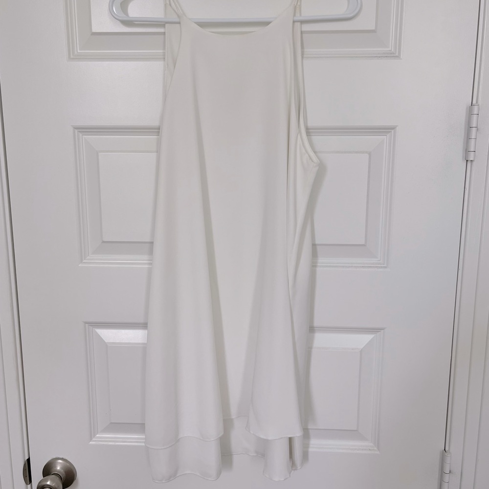 White boutique dress. 100% polyester. Size M